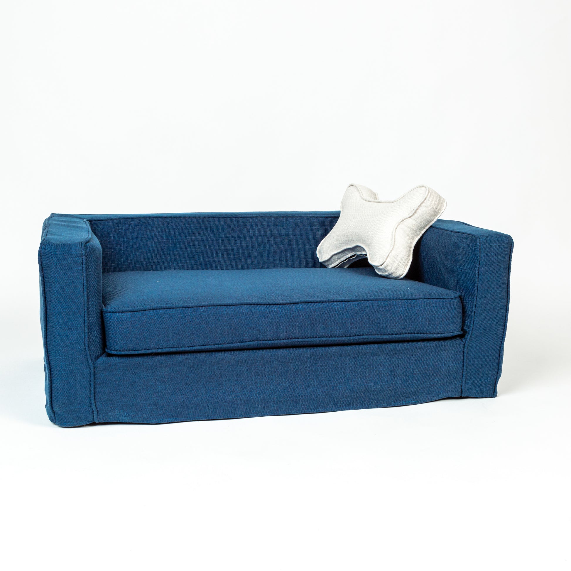 A comfortable dog bed with a soft blue slipcover. The bed has a plush cushion for added comfort and the slipcover is removable for easy cleaning. The fabric has a smooth texture, creating a cozy space for dogs to rest.