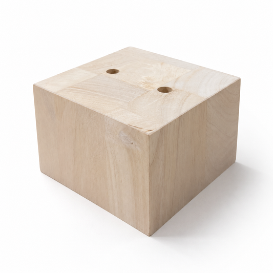 Solid unfinished parawood square block sofa leg with two pre-drilled holes, 4.25 by 4.25 inches and 3 inches tall.